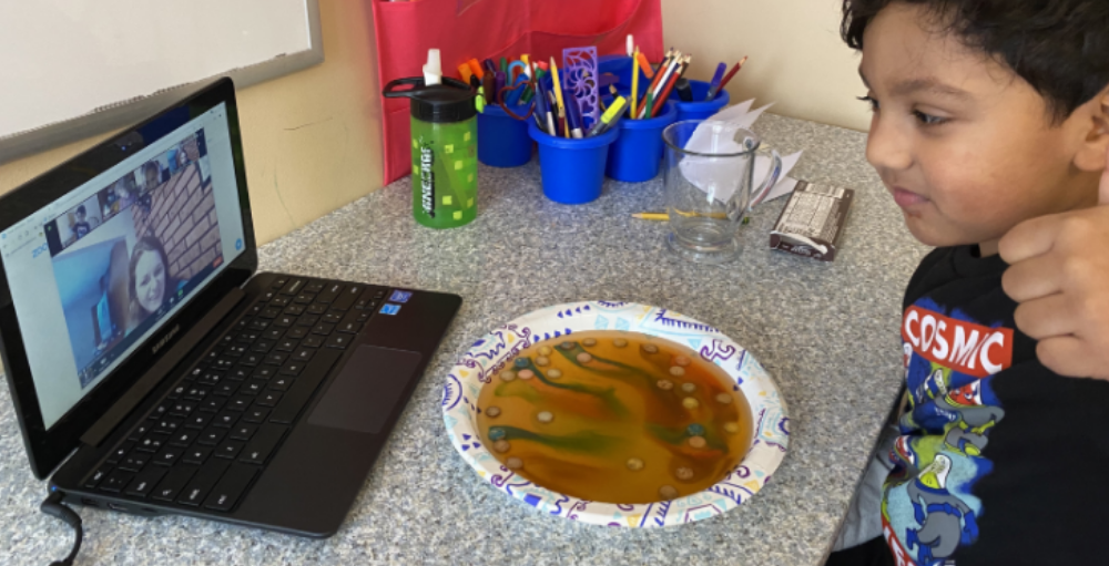 Utica Academy of Science kindergarten students perform a science experiment using Skittles.