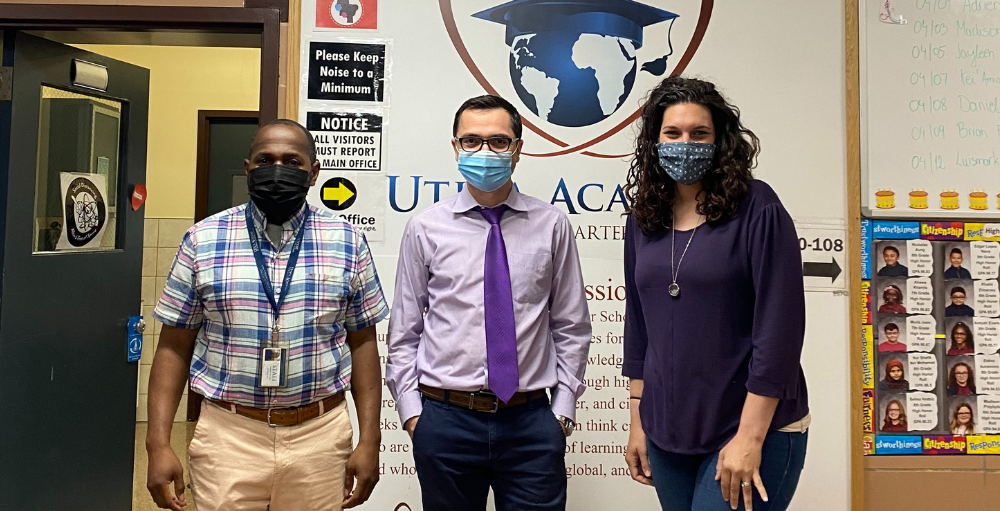 Utica Academy of Science middle school faculty and staff wear various shades of purple to show their support for Military families on Purple Up! For Military Kids Day.