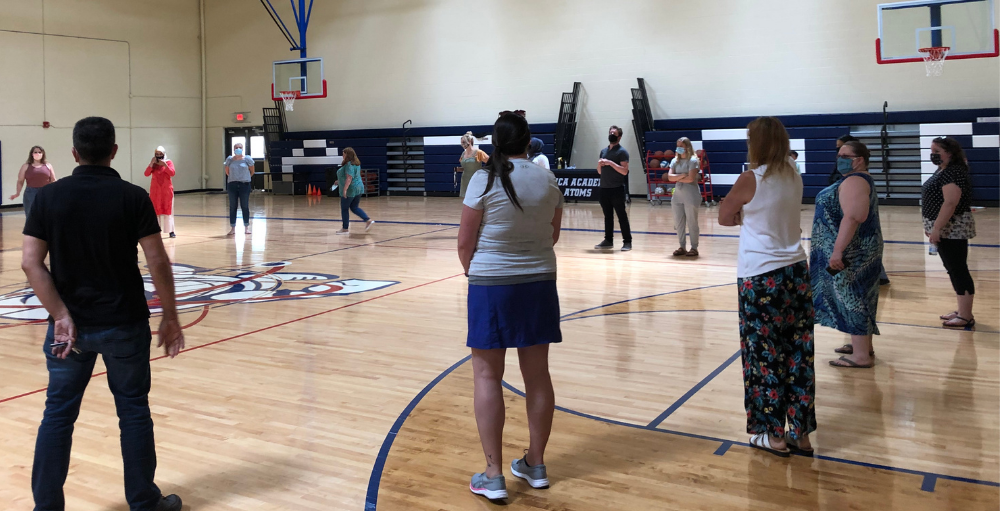 Utica Academy of Science middle school teachers, faculty and staff prepare for their upcoming move in the fall of 2021 by  touring the high school and visiting their new classrooms.
