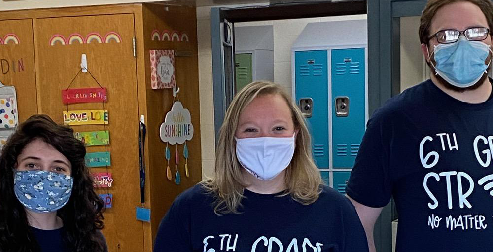 Middle school teachers wear custom t-shirts to show unity for their distance learning students.