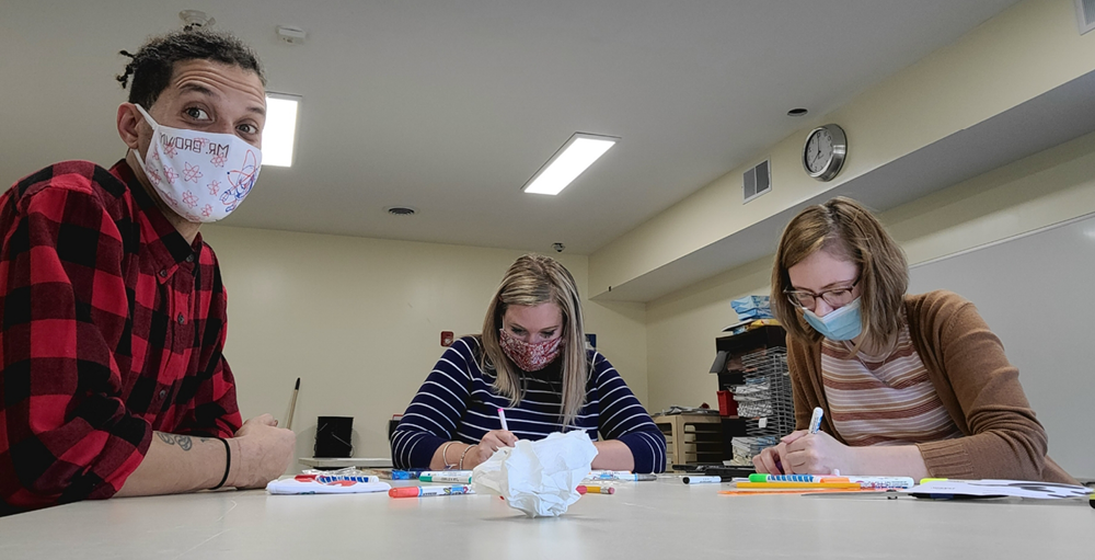 Utica Academy of Science high school teachers decorate SANY face masks at their teachers workshop