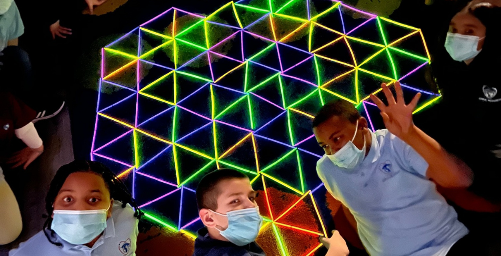 Utica Academy of Science elementary school students in the Crazy 8’s Math Club learned about 2D geometrical shapes and repeating patterns using glow sticks.