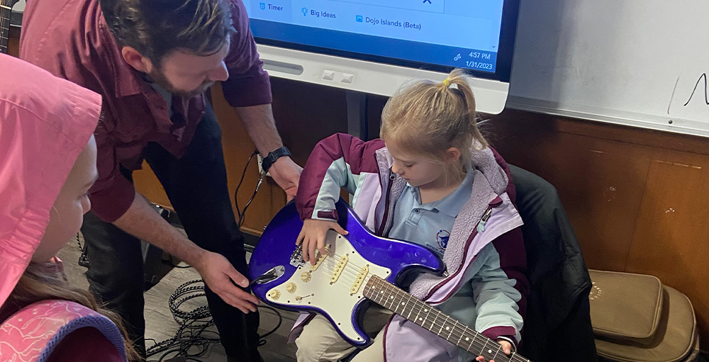 Utica Academy of Science Performing Arts Club is Visited by a Local Musician