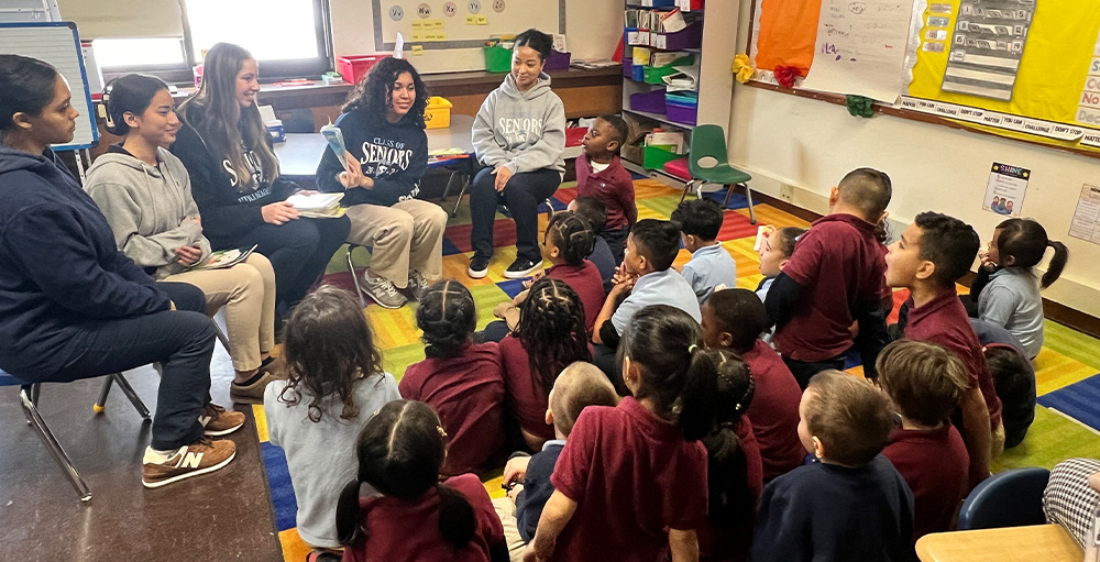 The Utica Academy of Science Class of 2024 Reads to Elementary School Students 