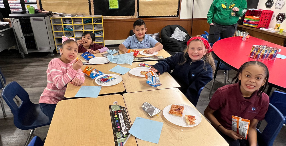 Second Grade Atoms At Utica Academy of Science Earn a Pizza Party for Donating the Most Items to a Food Drive